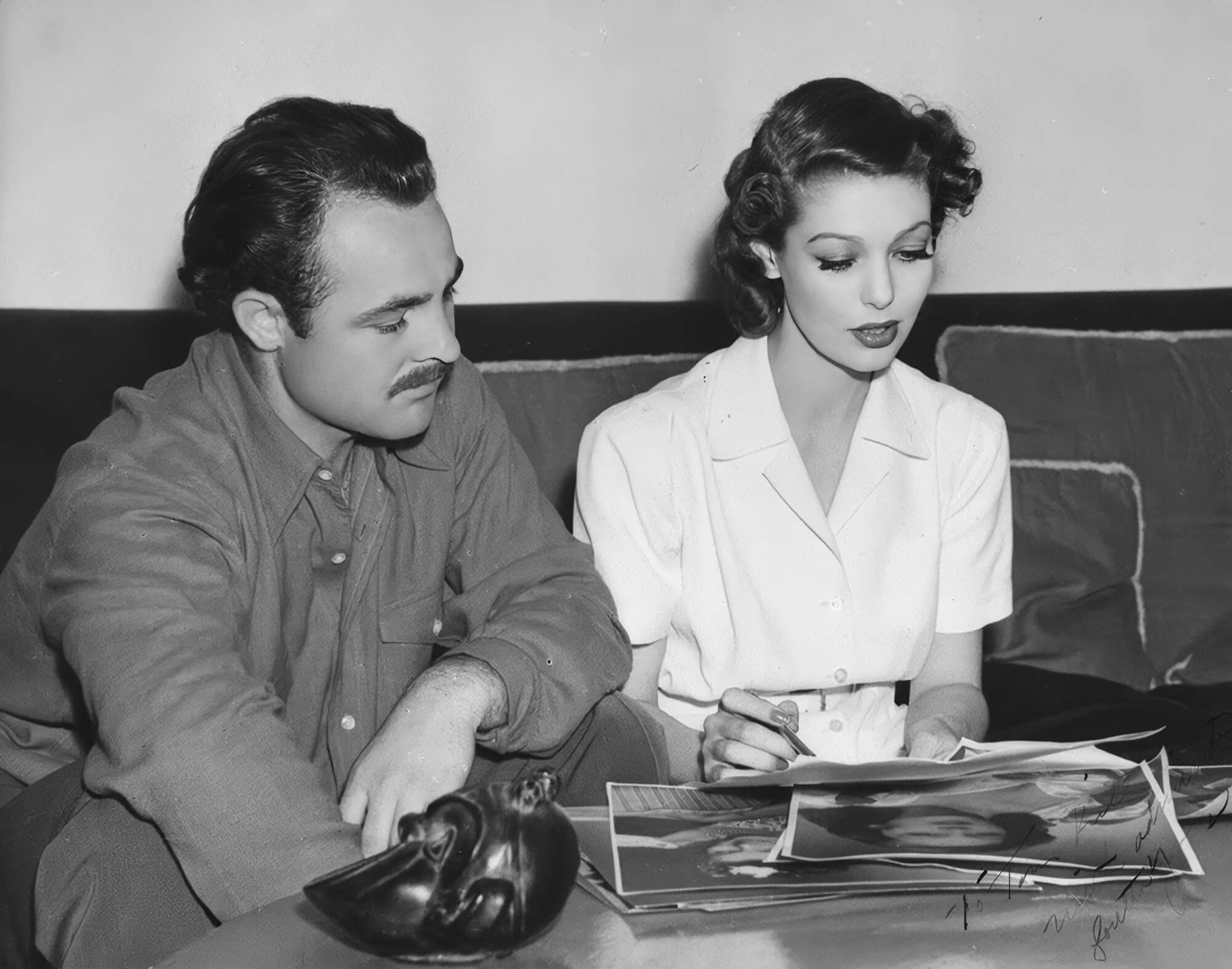 Reviewing headshots with actress Arleen Whelan, Tom Kelley consults on the perfect selection for publicity use. Reviewing headshots with actress Arleen Whelan, Tom Kelley consults on the perfect selection for publicity use.